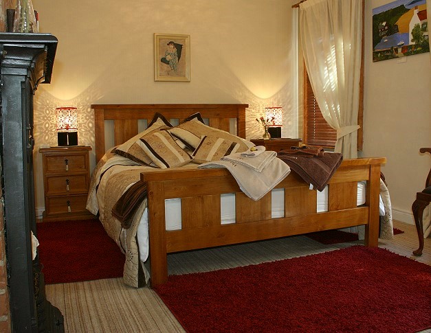 Our large and luxurious, 5 feet wide bed, 6.5 feet in length with new mattress (replaced annually).